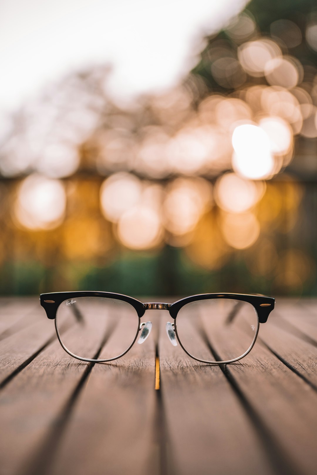 black-framed-eyeglasses-on-brown-wooden-table-bsjqyqukcjy
